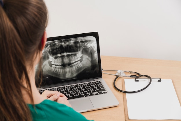 Nurse looking at laptop