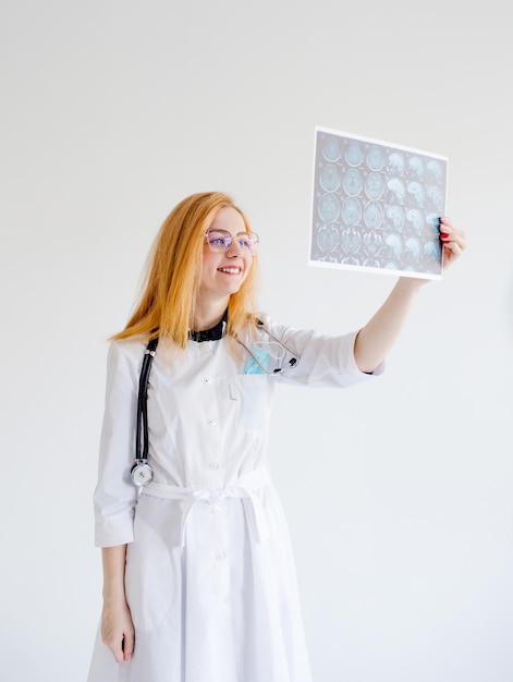 A nurse observes magnetic resonance imaging on a white isolated background