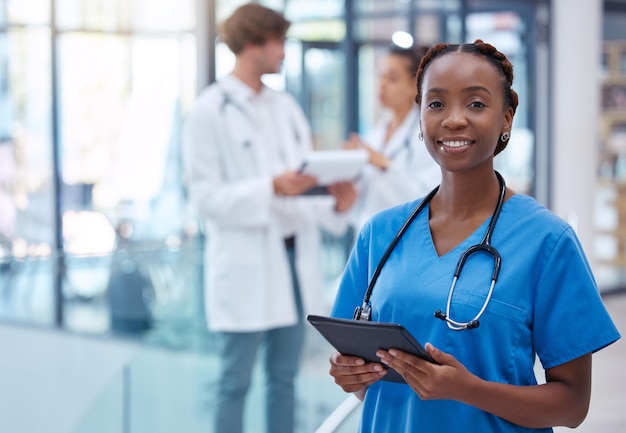 Nurse professional and healthcare worker with tablet in medical center clinic and hospital while analyzing test result Portrait of frontline worker showing trust care and knowledge about medicine