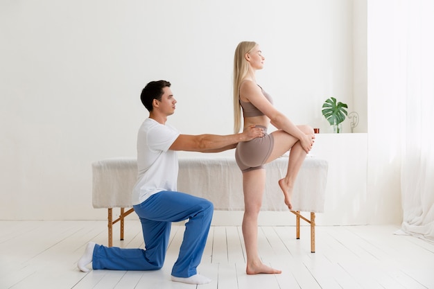 Nurse with patient in osteopathy session