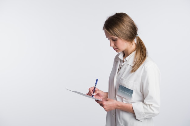 Nurse or young doctor standing isolated