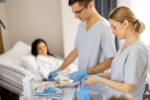 Nurses preparing for medical procedures in a ward