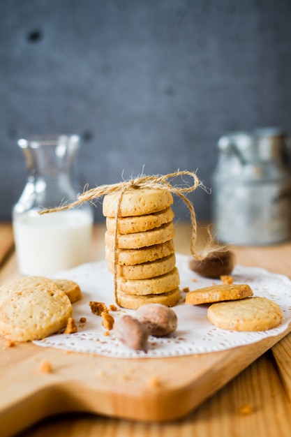 Nut and cookies and jar of milk on the background