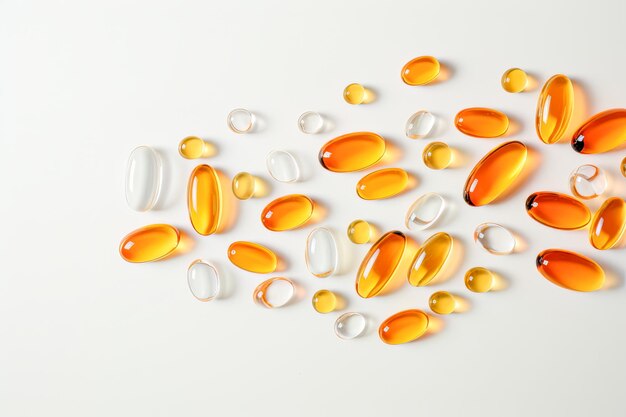 Nutritional supplements in the shape of yellow capsules on a pale backdrop