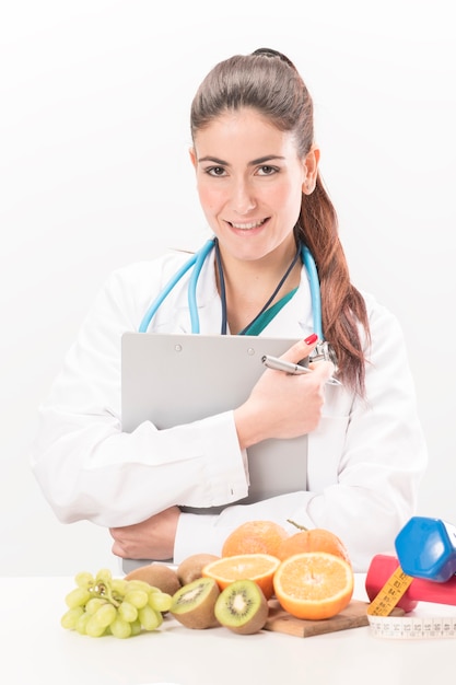 Nutritionist doctor woman. Isolated on white