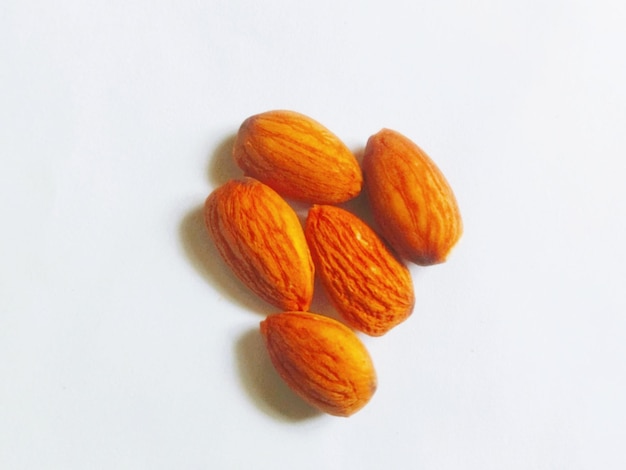 The nuts are on a white surface