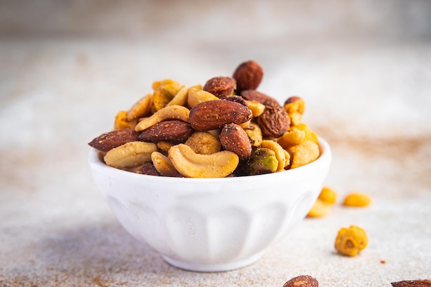 nuts mix almonds, cashews, pistachios, peanuts fresh healthy meal food snack on the table