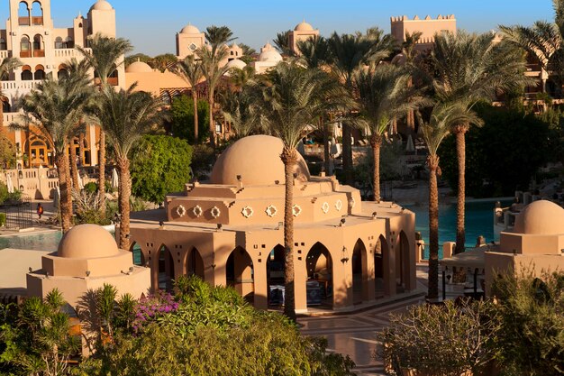 An oasis of palm trees and greenery photo Houses along the beach in Makadi Egypt