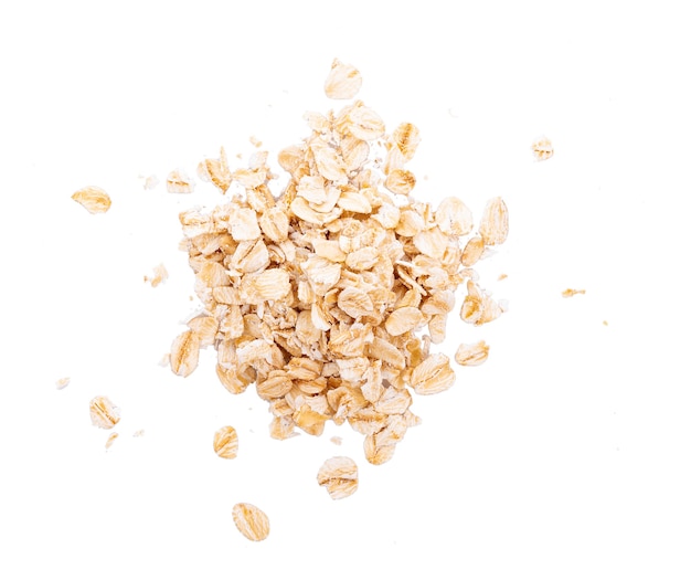 Oat flakes pile on white background