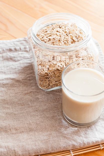 Oat milk in a glass on a table