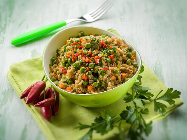 Oat with peas carrots and hot chili pepper selective focus