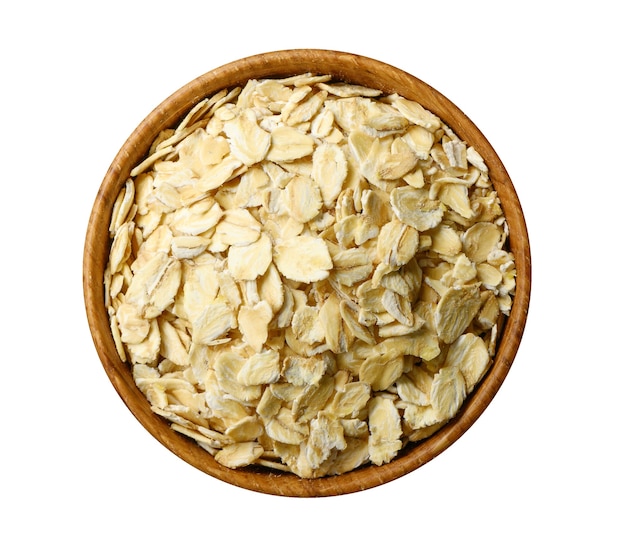 Oatmeal flakes in wooden bowl isolated on white background. Top view, directly above