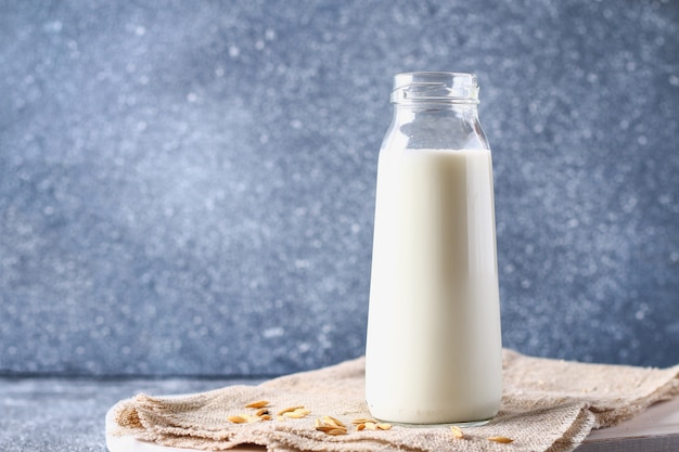 Oatmeal in a glass bottle. Oat grain and cereal in jars.