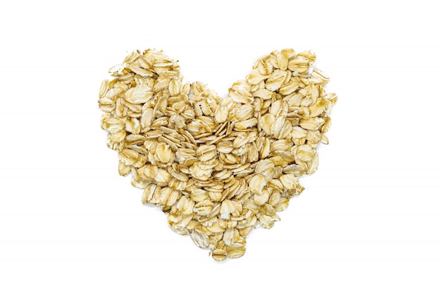 Oatmeal, heart-shaped, macro, close up, top view. Popular healthy breakfast food. 