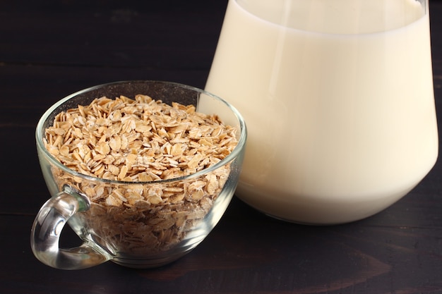 Oatmeal and milk on a dark surface