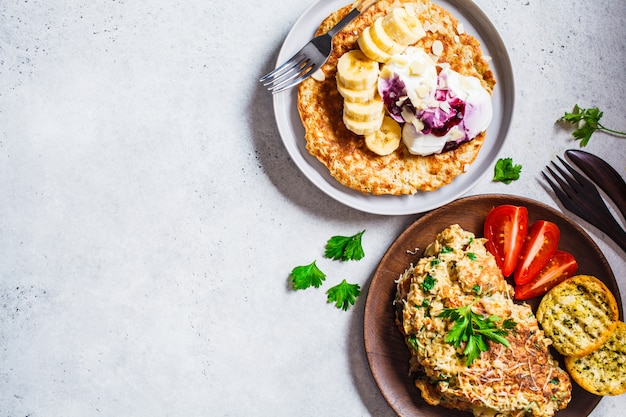 Oatmeal omelet with cheese and sweet oatmeal pancake, top view, 