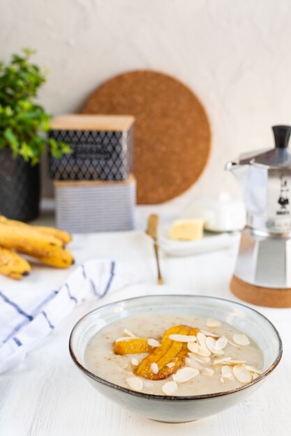 Oatmeal with bananas and almonds, moka coffee maker