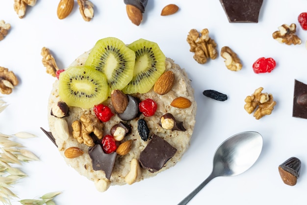 Oatmeal with fruit, chocolate and honey. Breakfast.