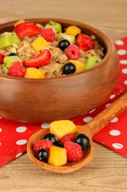 Oatmeal with fruits on table closeup