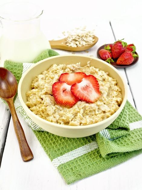 Oatmeal with strawberries on green napkin