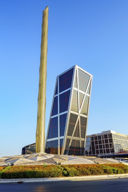 Obelisk in the center of Plaza Castilla and modern office buildings of inclined construction Madrid