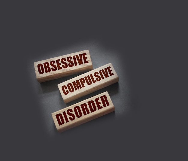 Photo obsessive compulsive disorder words on wooden blocks psychiatry psychological problem concept ocd