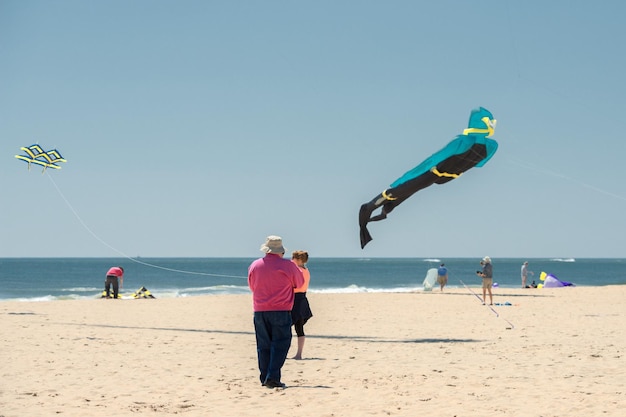 OCEAN CITY, USA - APRIL 24, 2014 - People walking the boardwalk in Maryland  famous ocean city