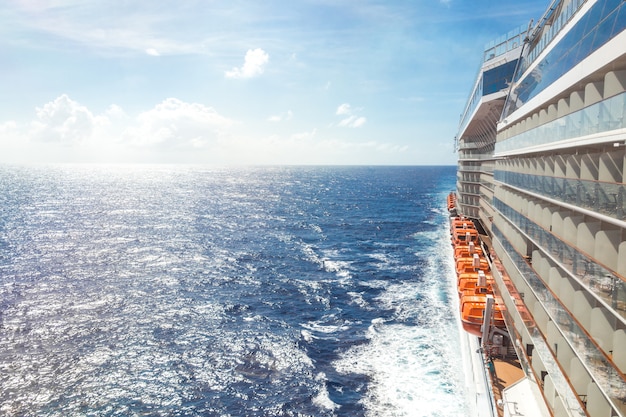 Ocean view from a cruise ship deck on a bright day