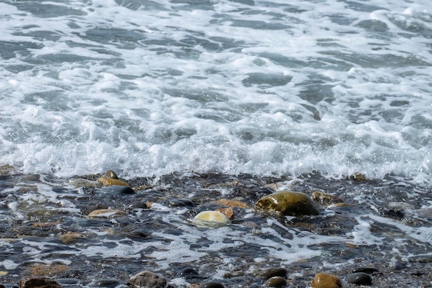 Ocean waves crashing on sandy beach Sea waves breaking on Maditerranean's shore