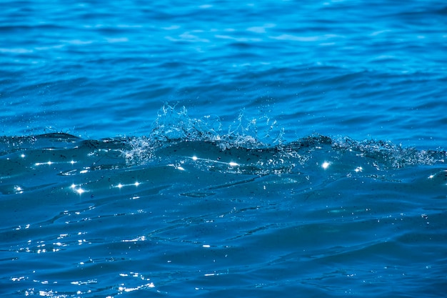 Ocean waves crashing on sandy beach Sea waves breaking on shore