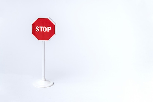 Octagonal red stop sign on white background