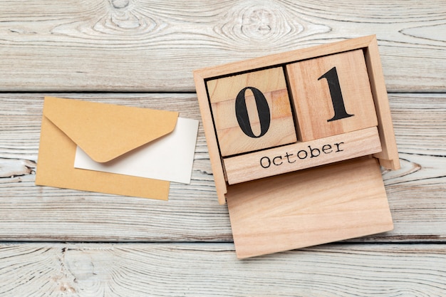 October 1st .October 1 white wooden calendar on  wood table