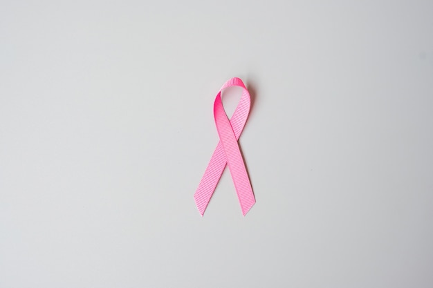 October Breast Cancer Awareness month, Pink Ribbon on grey background for supporting people living and illness. International Women, Mother and World cancer day concept