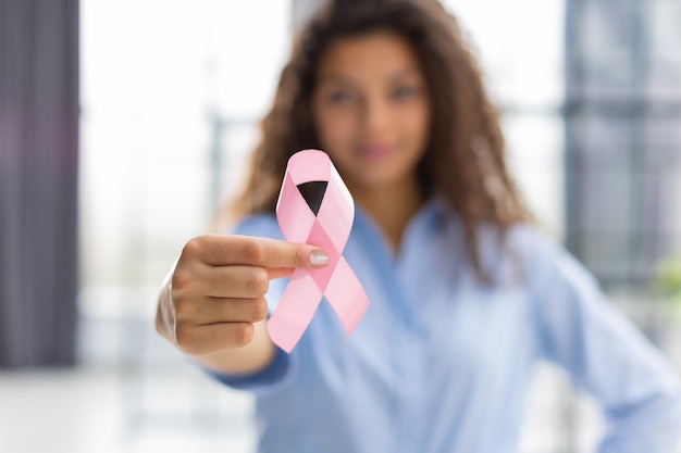 October breast cancer awareness month woman with hand holding pink ribbon for supporting people living and illness Healthcare world cancer day concept