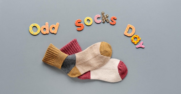 Odd Socks Day Pair of mismatched school socks Wooden rainbow Social initiative against bullying in school or workplace