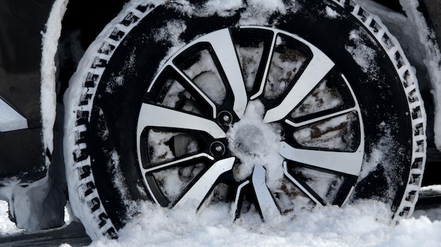 Off road truck wheel on the snow close up stock photo