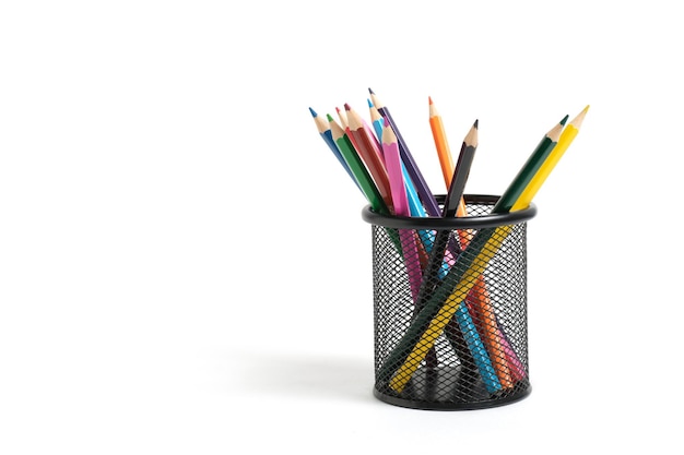 Office basket with colored pencils on a white background.