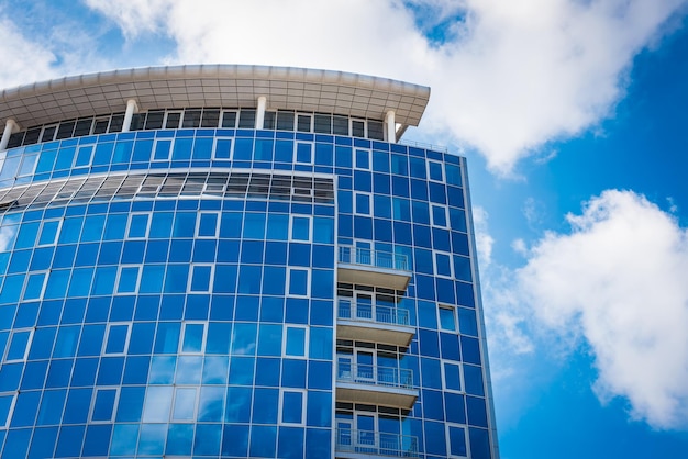 Office Building blue sky and clouds reflections in windows