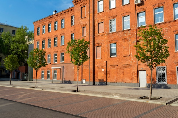 Office building of red brick in the yard of the old factory