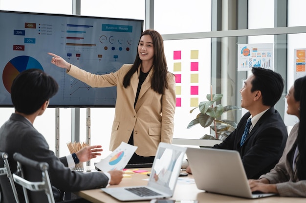 Office colleagues having casual discussion during meeting in conference room Business and office concept business team with laptop computers and documents