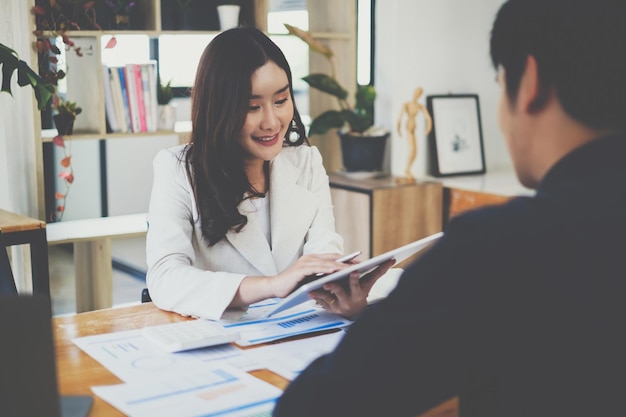 At the office desk a company team is organizing a successful team building project Financial concept