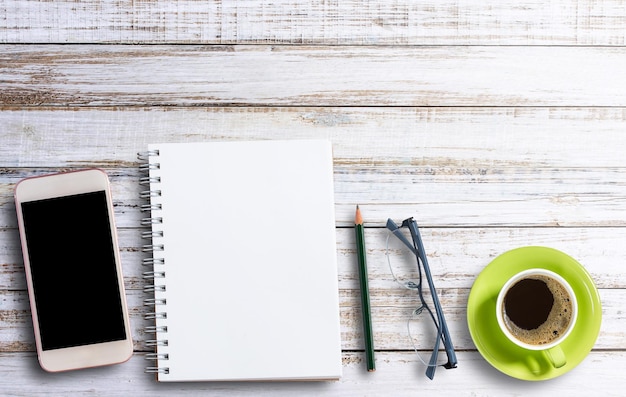 Office desk concept notebook and coffee