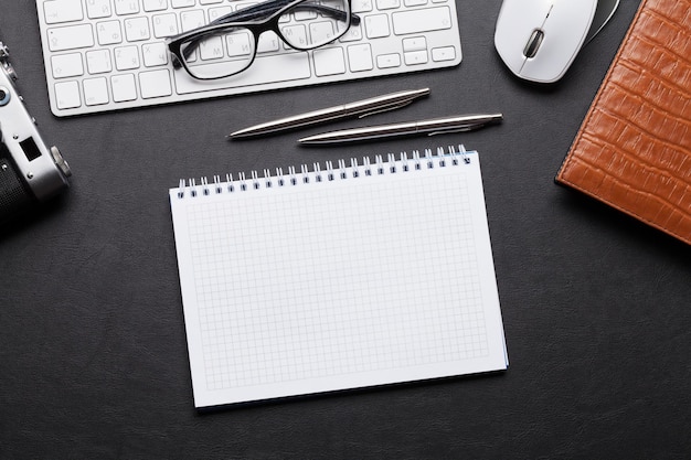 Office desk with camera pc notepad