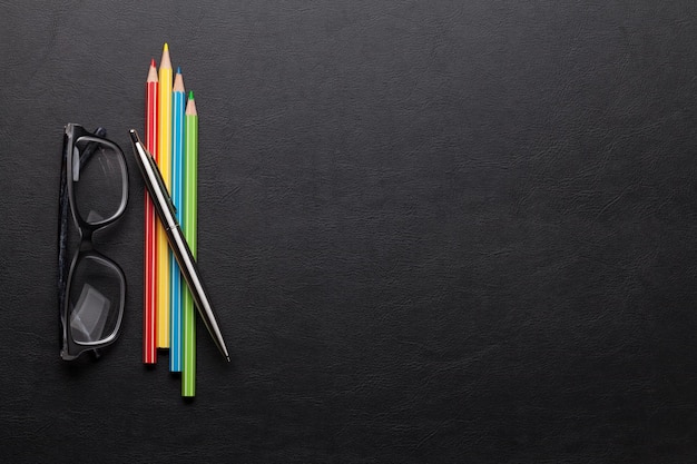 Office desk with colorful pencils