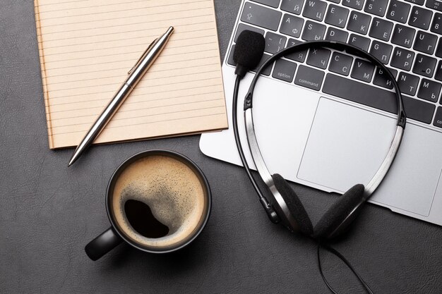 Photo office desk with headset and laptop