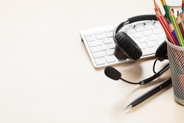 Office desk with headset and pc