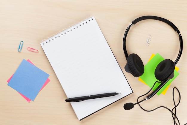 Office desk with headset and supplies Call center