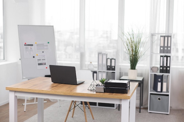 office desk with laptop, computer keyboard, tablet pc and smartphone. copy space