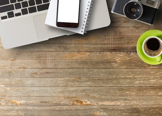 Office desk with notebook and coffee