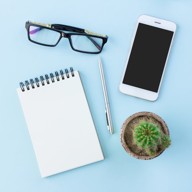 office equipment on blue background in top view